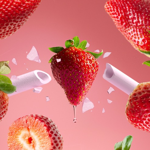 Strawberry and edible straws bursting apart